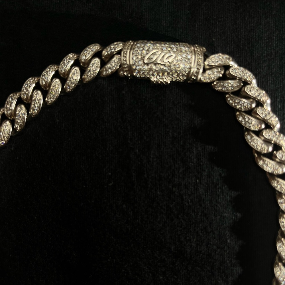 White gold Cuban link chain.